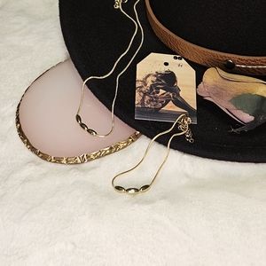 18k gold past, present & future necklace and bracelet set.
